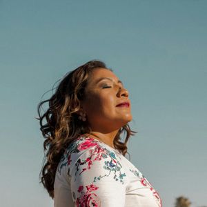 Profile of a man breathing deeply with eyes closed before a workout.